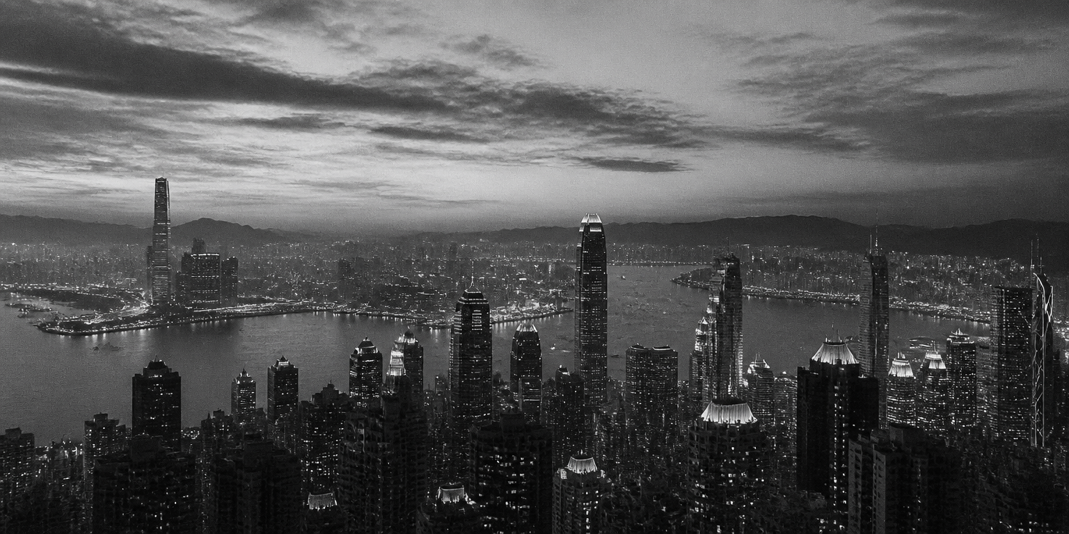 Aerial view of a coastal city skyline at dusk